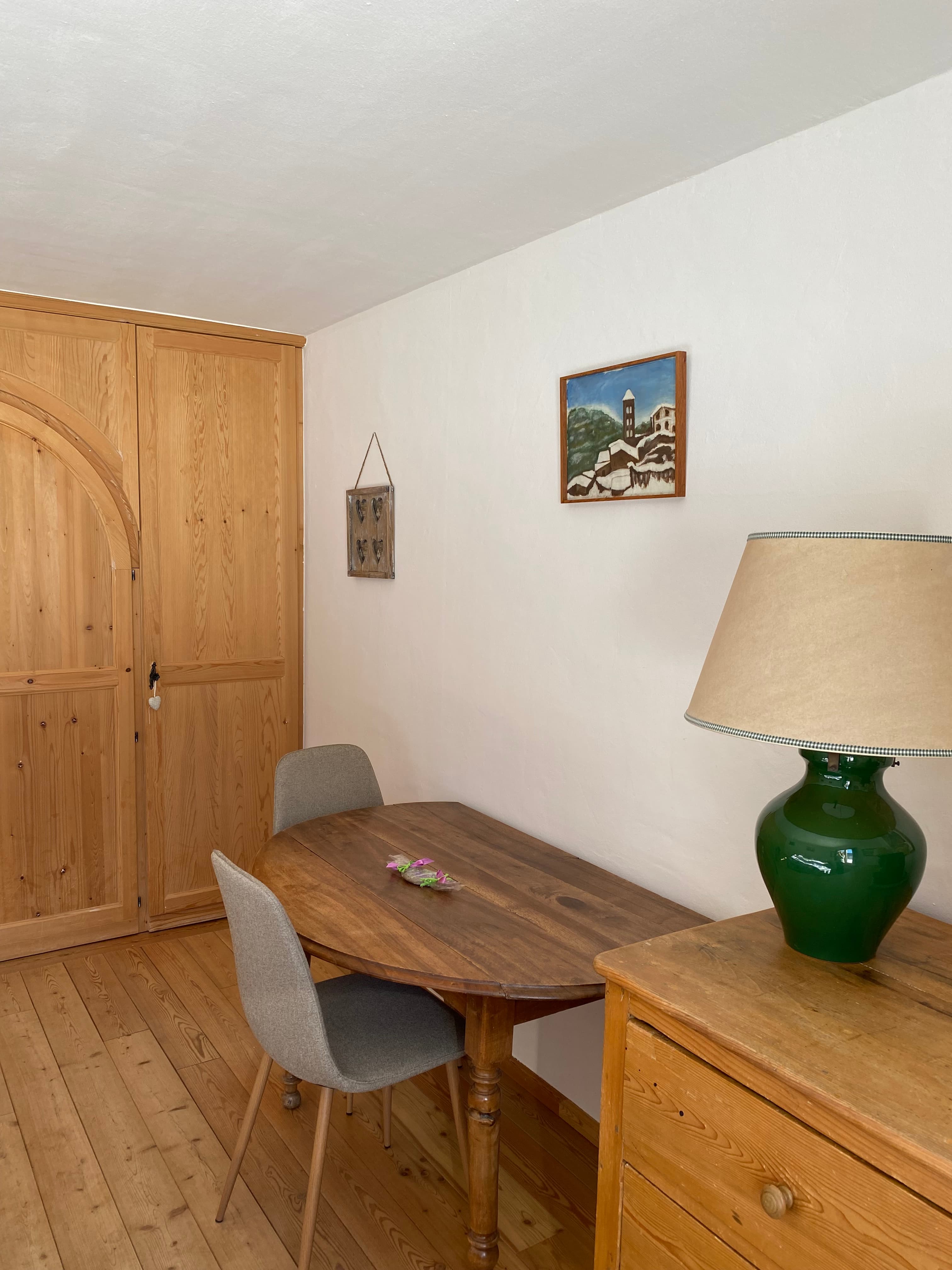 Cozy desk area with mountain painting